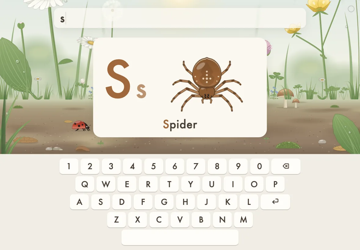 Letters and numbers on an iPad: a big S card with a spider, above an on-screen keyboard